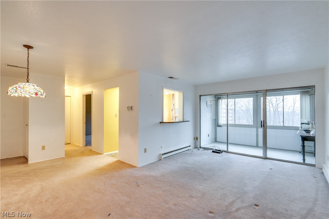 3070 Kent Road Stow, OH 44224 - Photo 21 of 43 Living room featuring baseboard heating and light colored carpet