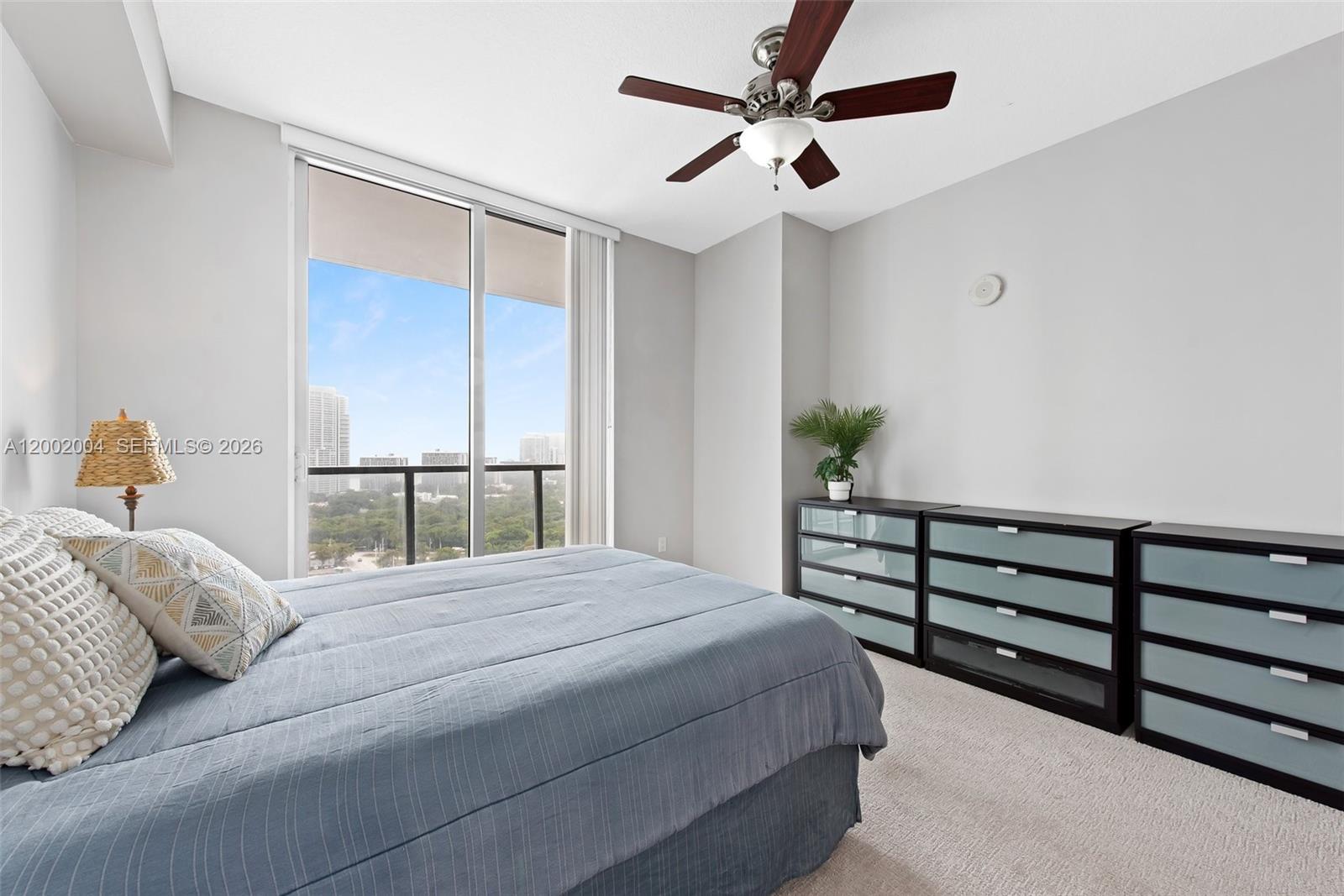 79 Southwest 12th Street, Unit 2503S Miami, FL 33130 - Photo 7 of 27 a bedroom with a bed and a window