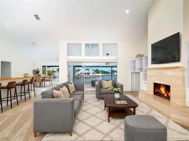 a living room with fireplace furniture and a flat screen tv