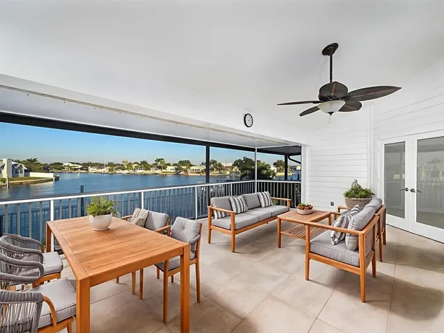 an aerial view of a house with a lake view
