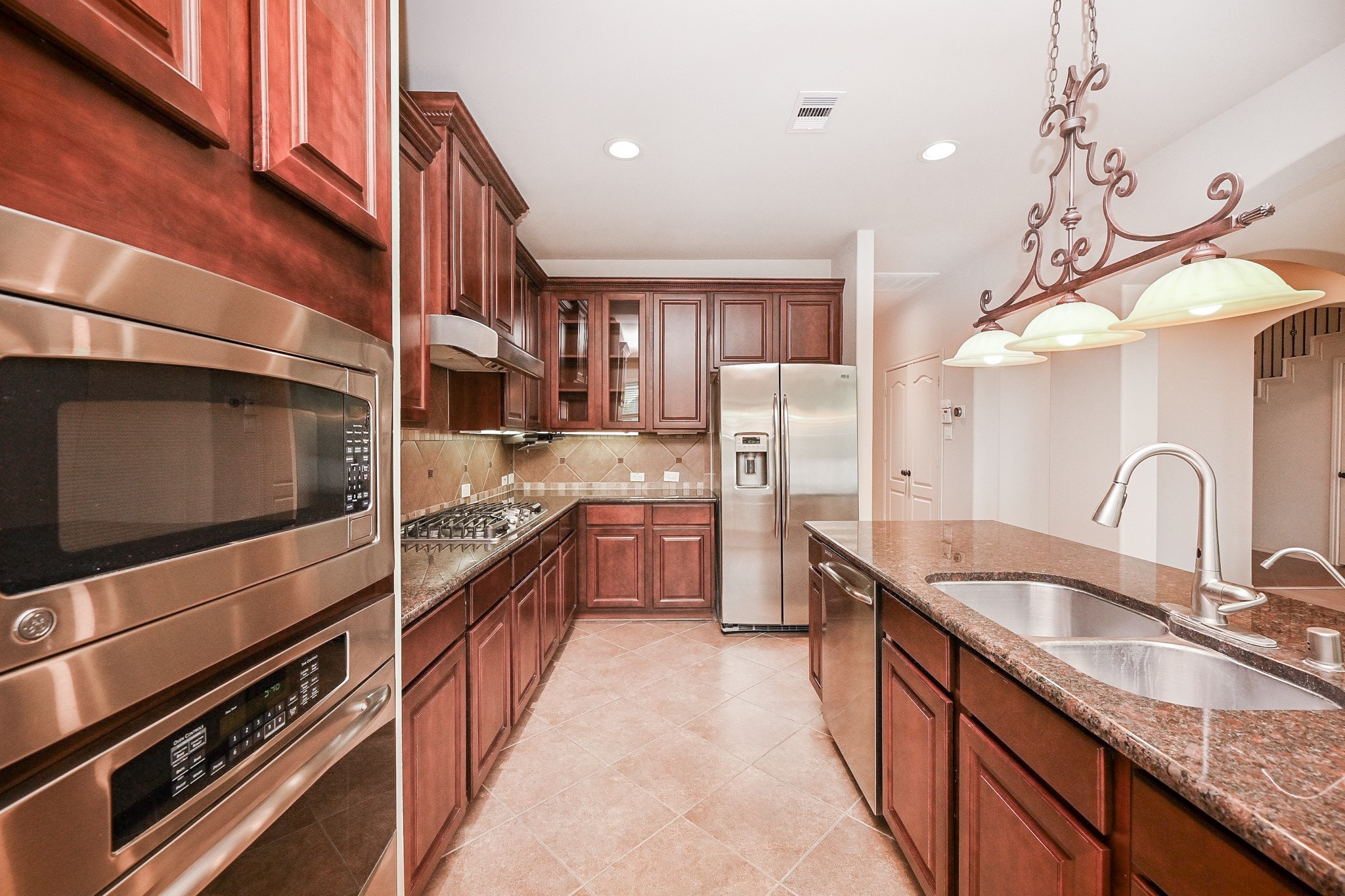 19 Sandwell Place Spring, TX 77389 - Photo 13 of 33 Kitchen with central island and stainless steel appliances