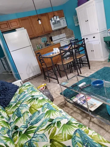 a view of swimming pool with a patio