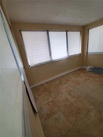 a view of an empty room with window