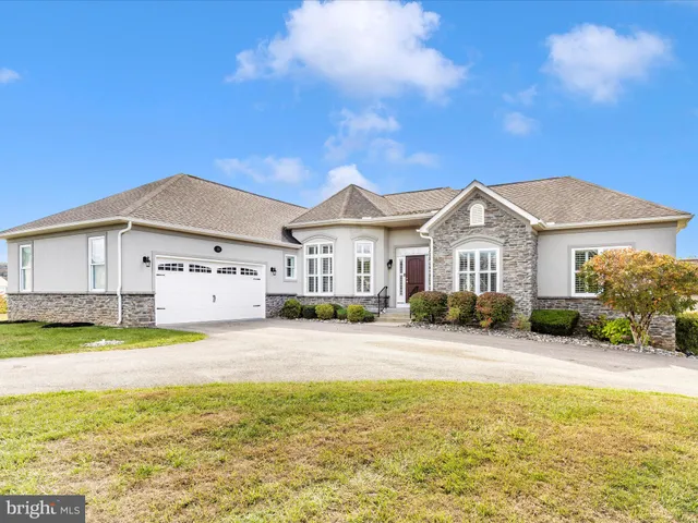 a view of a house with swimming pool and a yard
