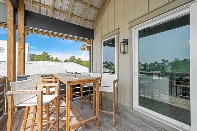 a view of balcony with furniture and window