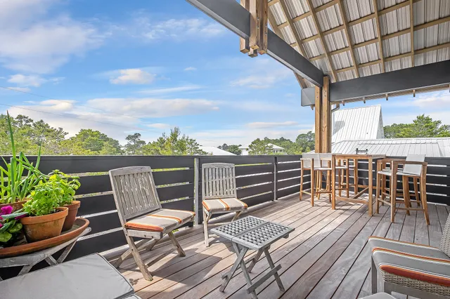 a view of a patio with wooden floor