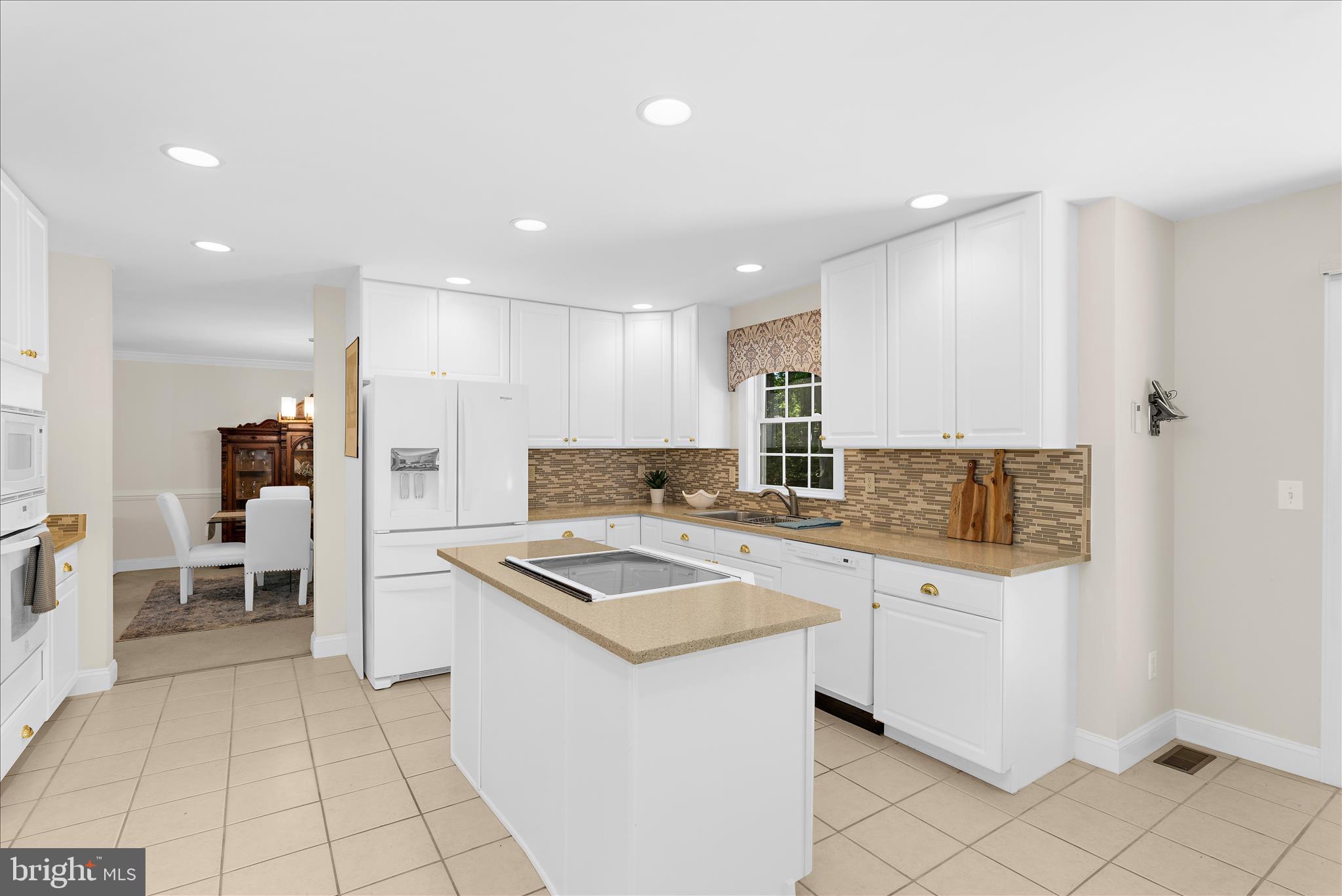 1848 Cherry Road Annapolis, MD 21409 - Photo 6 of 57 a kitchen with white cabinets and stainless steel appliances