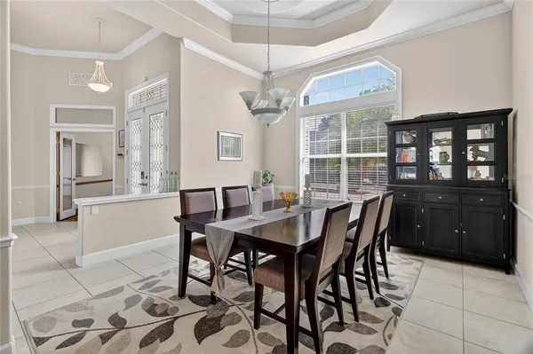 a kitchen with white cabinets and appliances