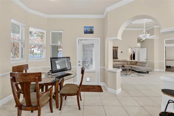 a kitchen with stainless steel appliances kitchen island granite countertop a refrigerator and cabinets
