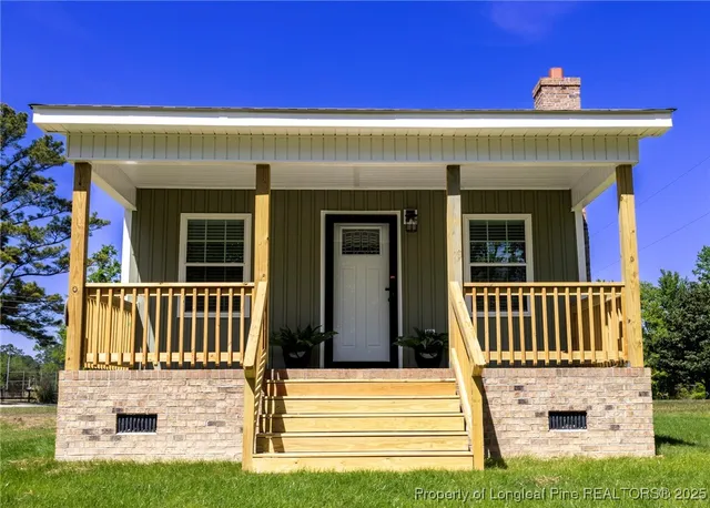 a front view of a house with a porch
