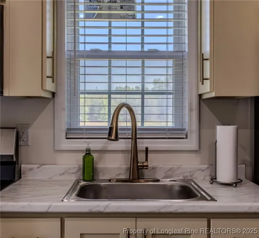 a kitchen with a sink and a window