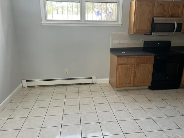 a kitchen with a sink and a microwave