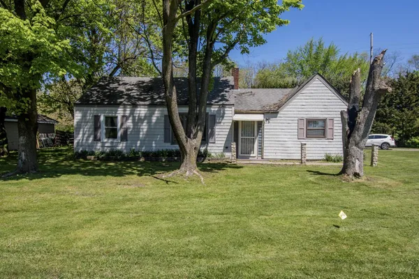 a house with a tree in front of it