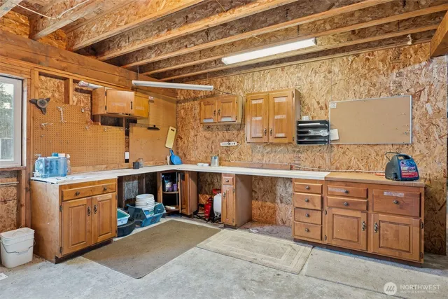 a utility room with sink dryer and washer