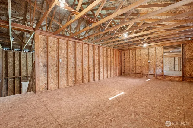 a view of an empty room with wooden walls