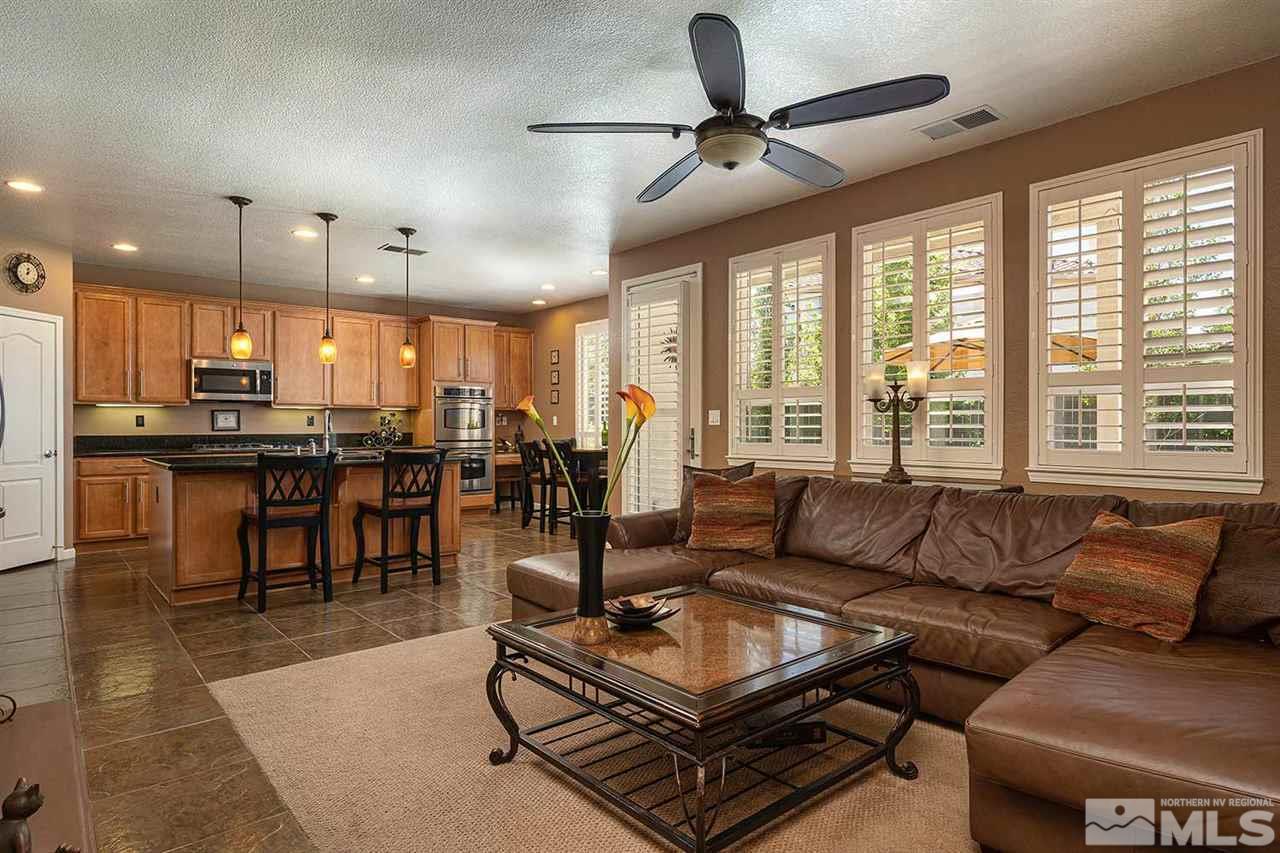 490 Oldenburg Drive Reno, NV 89521 - Photo 1 of 25 a living room with furniture and a large window with kitchen view