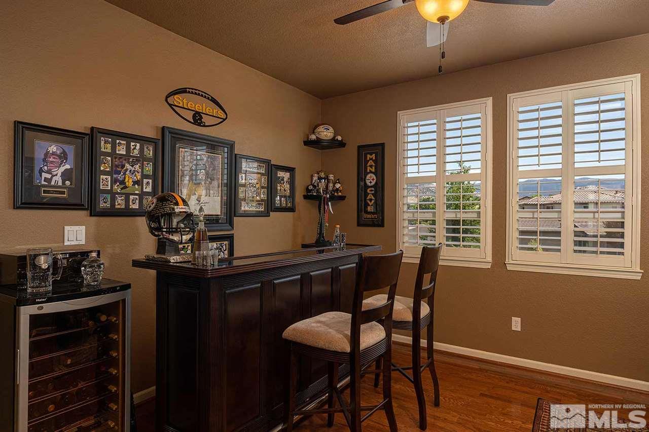 490 Oldenburg Drive Reno, NV 89521 - Photo 11 of 25 a view of a dining room with furniture and chandelier