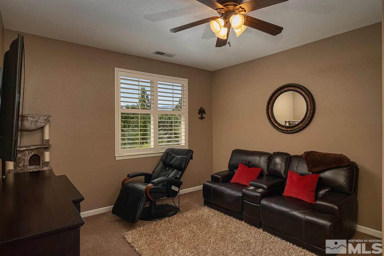 490 Oldenburg Drive Reno, NV 89521 - Photo 14 of 25 a living room with furniture and a flat screen tv