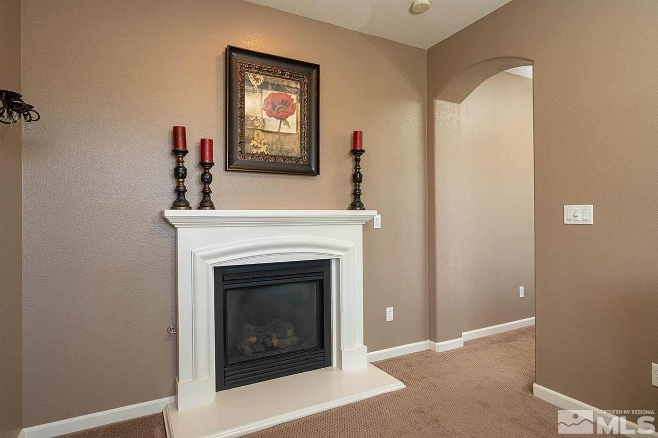 490 Oldenburg Drive Reno, NV 89521 - Photo 15 of 25 a living room with furniture and a fireplace