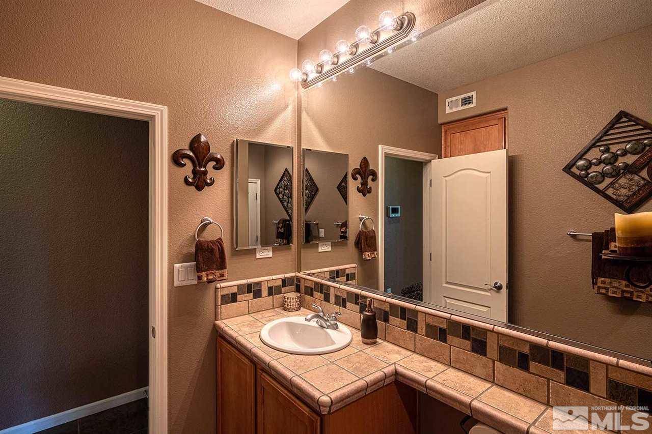 490 Oldenburg Drive Reno, NV 89521 - Photo 16 of 25 a bathroom with a sink and a mirror
