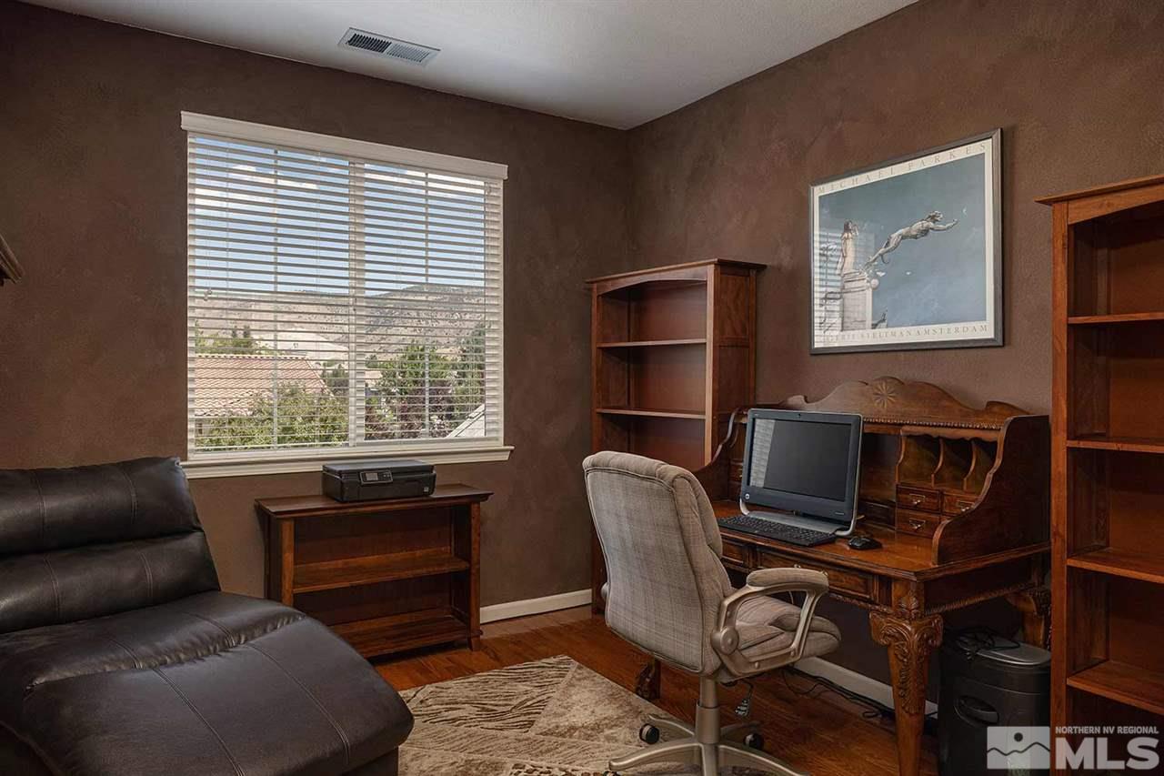 490 Oldenburg Drive Reno, NV 89521 - Photo 19 of 25 a view of a livingroom with workspace and a window