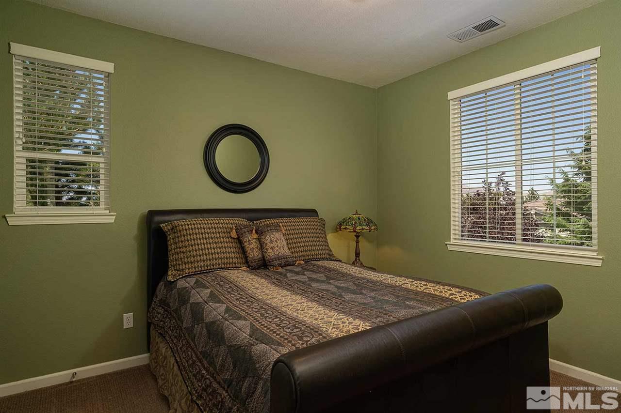 490 Oldenburg Drive Reno, NV 89521 - Photo 20 of 25 a bedroom with a bed and with a window