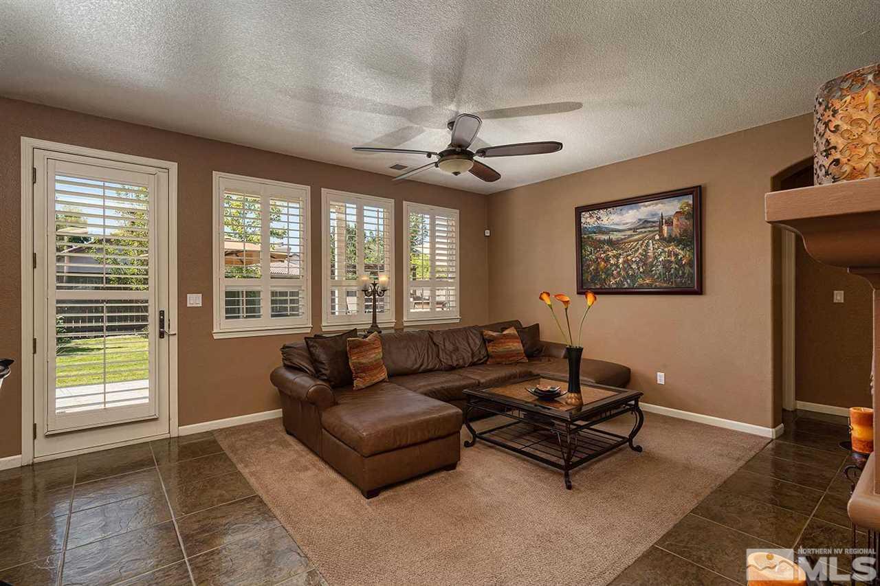 490 Oldenburg Drive Reno, NV 89521 - Photo 2 of 25 a living room with furniture and a large window