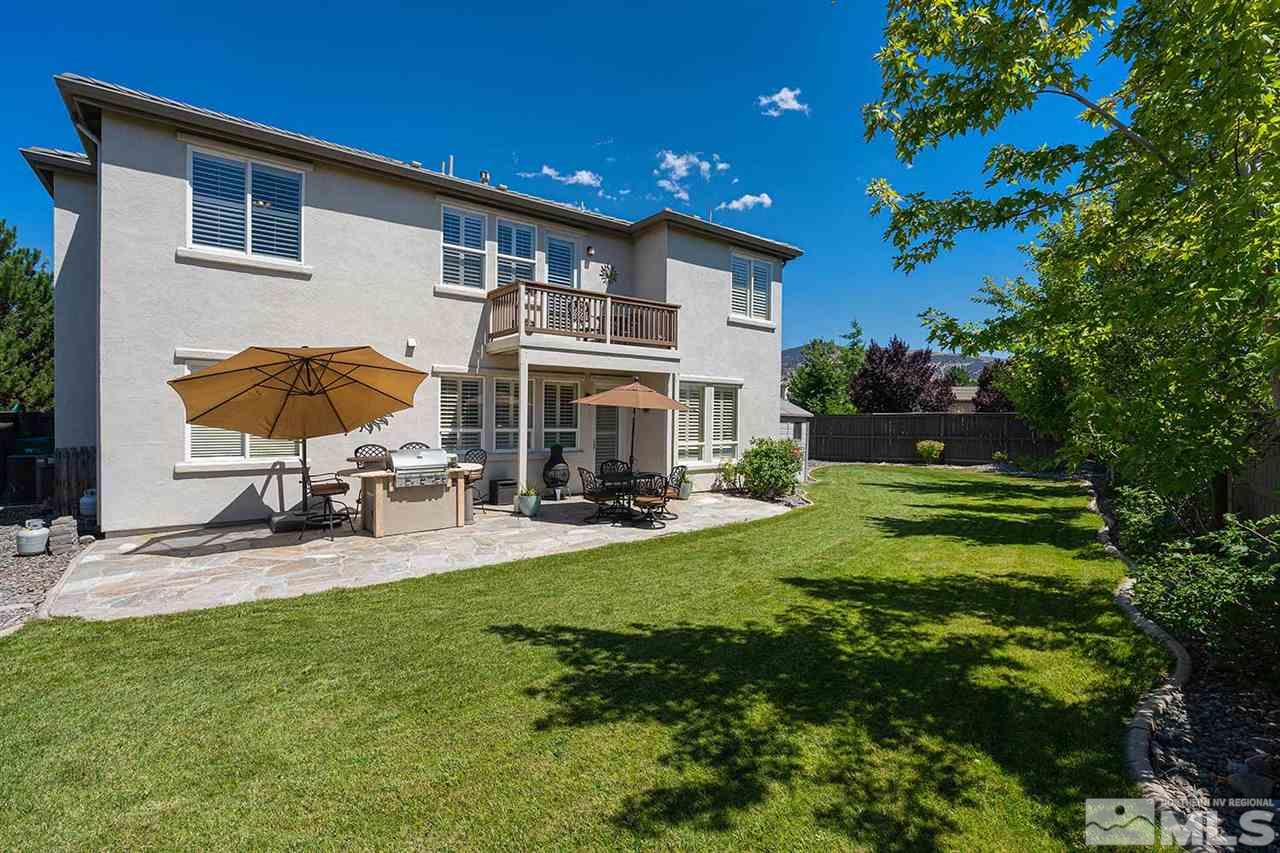 490 Oldenburg Drive Reno, NV 89521 - Photo 22 of 25 a view of house with backyard and swimming pool