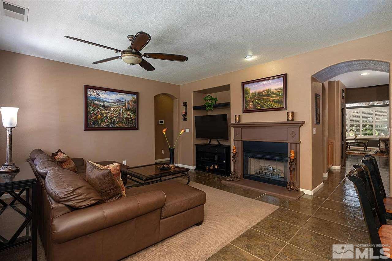 490 Oldenburg Drive Reno, NV 89521 - Photo 3 of 25 a living room with furniture and a fireplace