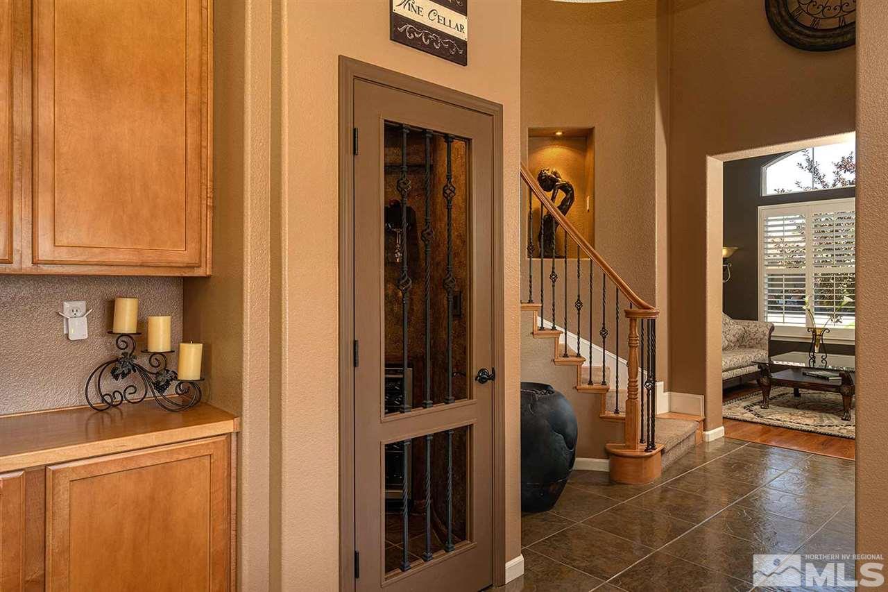 490 Oldenburg Drive Reno, NV 89521 - Photo 8 of 25 a view of a hallway with wooden floor and windows