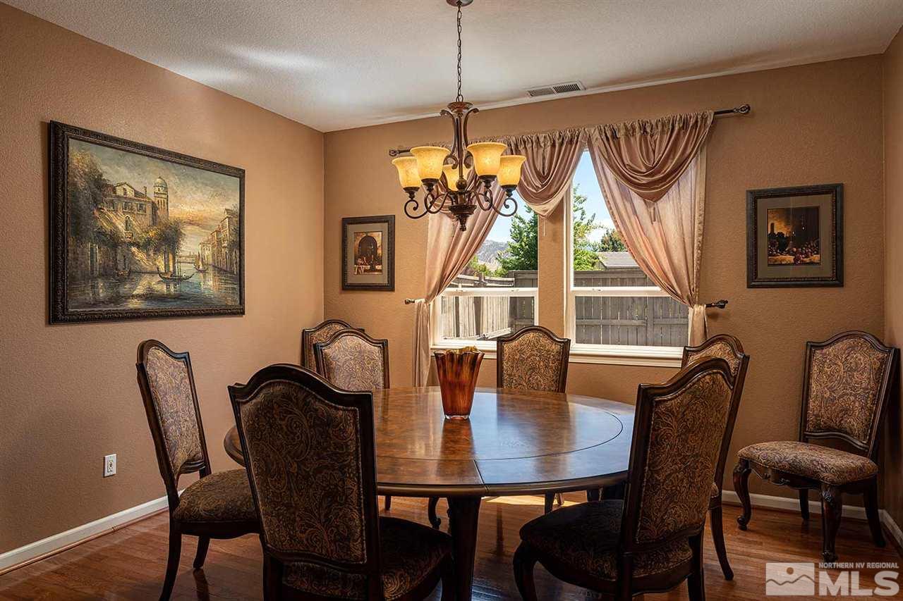 490 Oldenburg Drive Reno, NV 89521 - Photo 9 of 25 a view of a dining room with furniture window and wooden floor