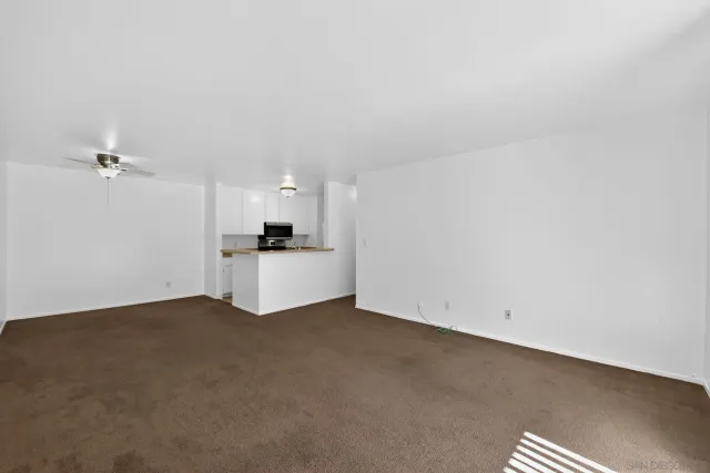 a view of a utility room with closet and a window