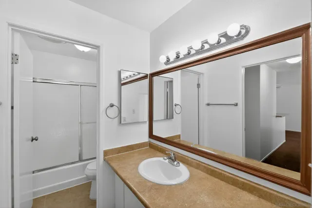 a bathroom with a sink and mirror