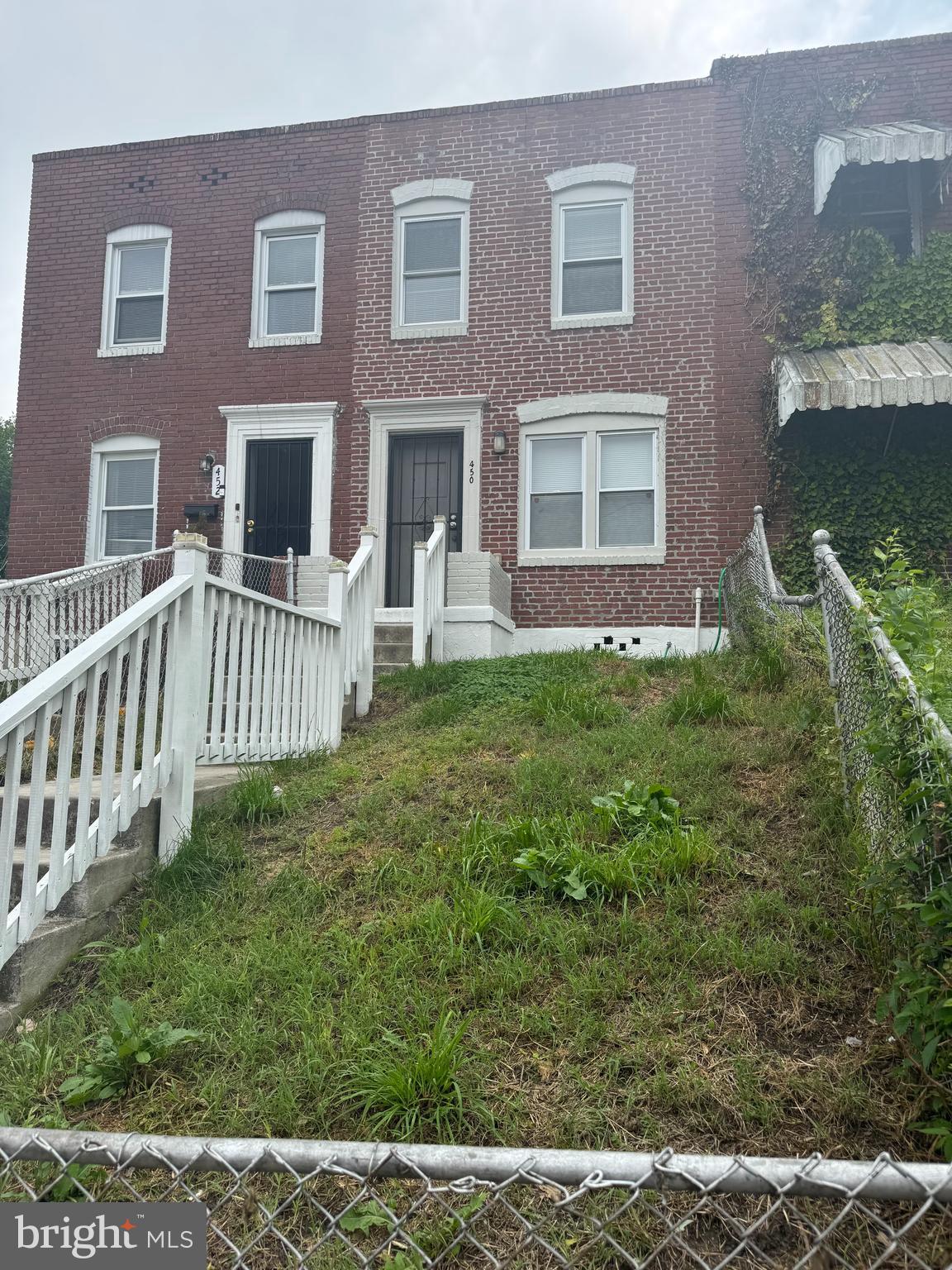 a view of a house with backyard porch and furniture