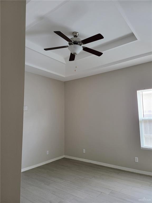 1900 Jackson Street, Unit 2 Weslaco, TX 78599 - Photo 9 of 13 an empty room with windows and fan