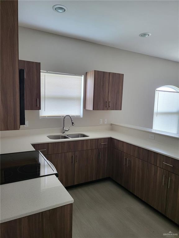 1900 Jackson Street, Unit 2 Weslaco, TX 78599 - Photo 11 of 13 a kitchen with a sink a stove and cabinets
