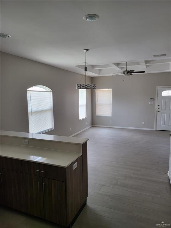 1900 Jackson Street, Unit 2 Weslaco, TX 78599 - Photo 8 of 13 a kitchen with a wooden floor and window