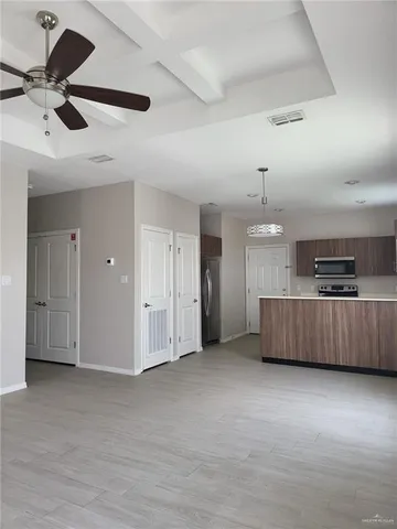 a kitchen with a sink a stove and cabinets