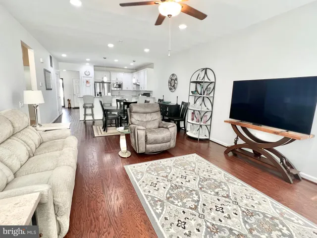 a living room with furniture and a rug