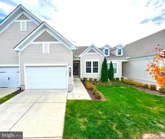 a view of swimming pool with a garden and trees