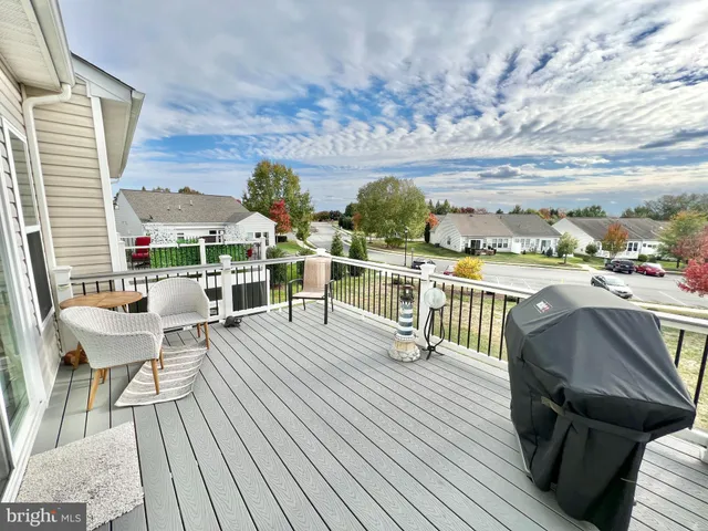 a view of a balcony with chairs