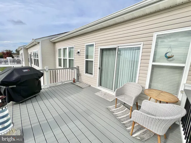 a view of a deck with furniture