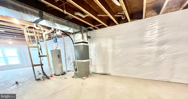 a view of a livingroom with furniture and staircase