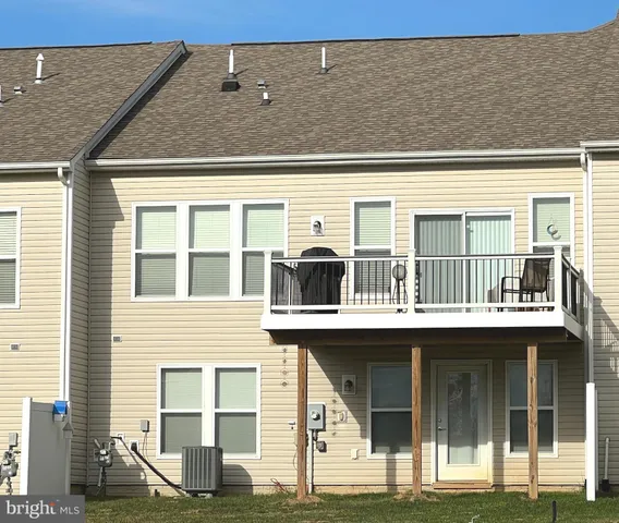 a view of an houses with outdoor space and lakeside