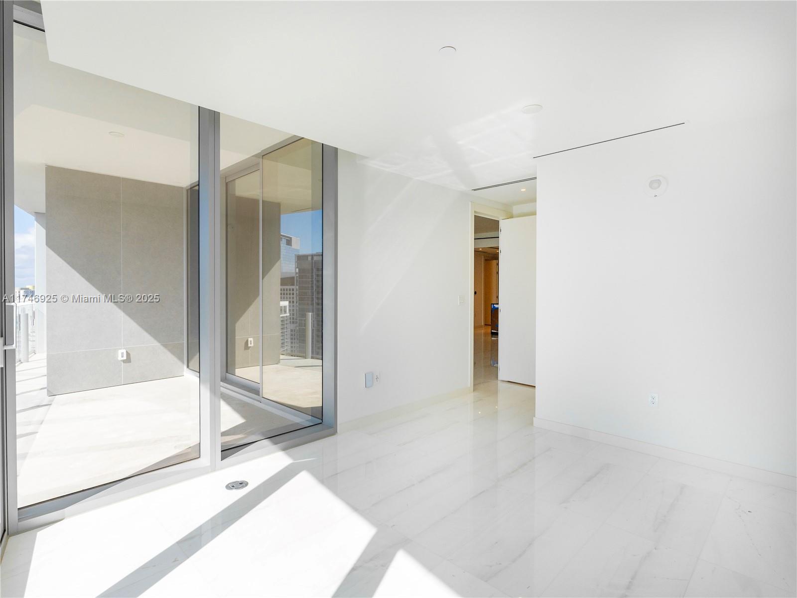 300 Biscayne Boulevard, Unit 4305 Miami, FL 33132 - Photo 16 of 32 a view of a hallway with wooden floor and a bathroom
