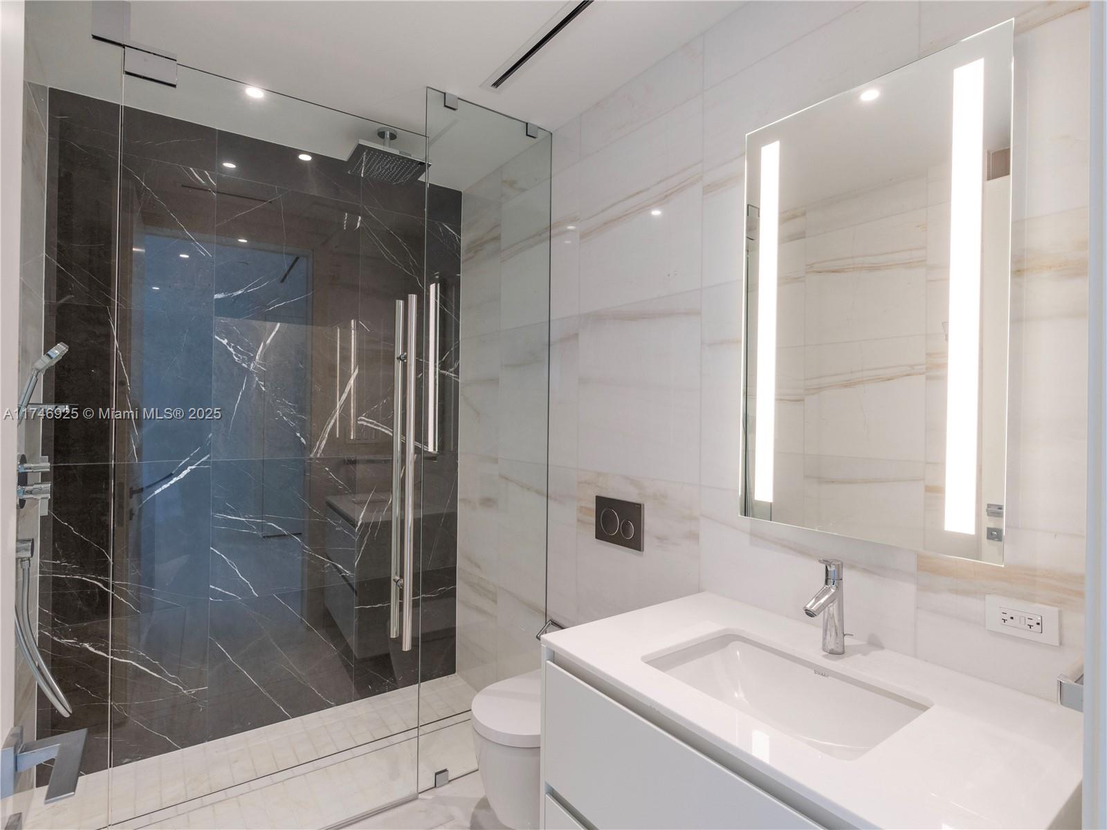 300 Biscayne Boulevard, Unit 4305 Miami, FL 33132 - Photo 18 of 32 a bathroom with a sink toilet and shower