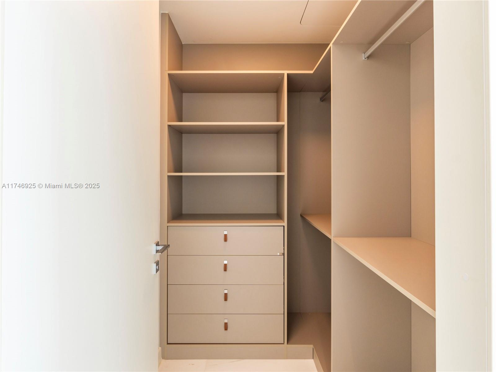 300 Biscayne Boulevard, Unit 4305 Miami, FL 33132 - Photo 19 of 32 a view of an empty walk in closet