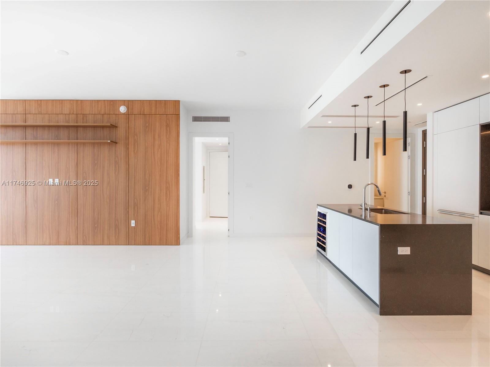 300 Biscayne Boulevard, Unit 4305 Miami, FL 33132 - Photo 3 of 32 a view of a kitchen with wooden cabinets