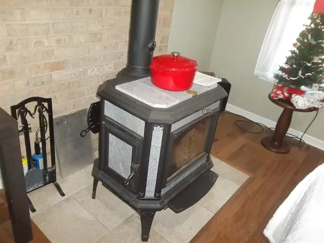 a bedroom with a bed and a flat tv screen on dresser