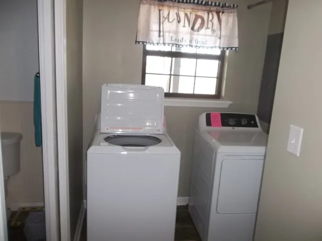 a bathroom with a sink a mirror a vanity and a shower